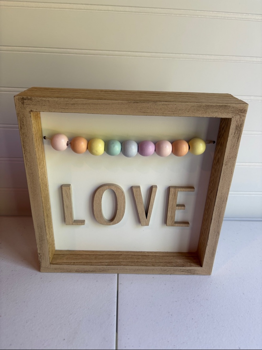 Wooden 'LOVE' Shadow Box Wall Art with Pastel Bead Garland